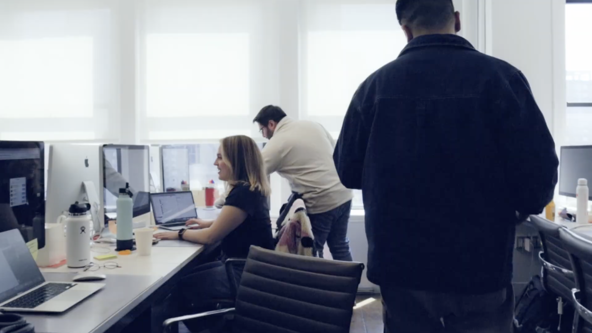 Day One Agency team members collaborating in a bright office