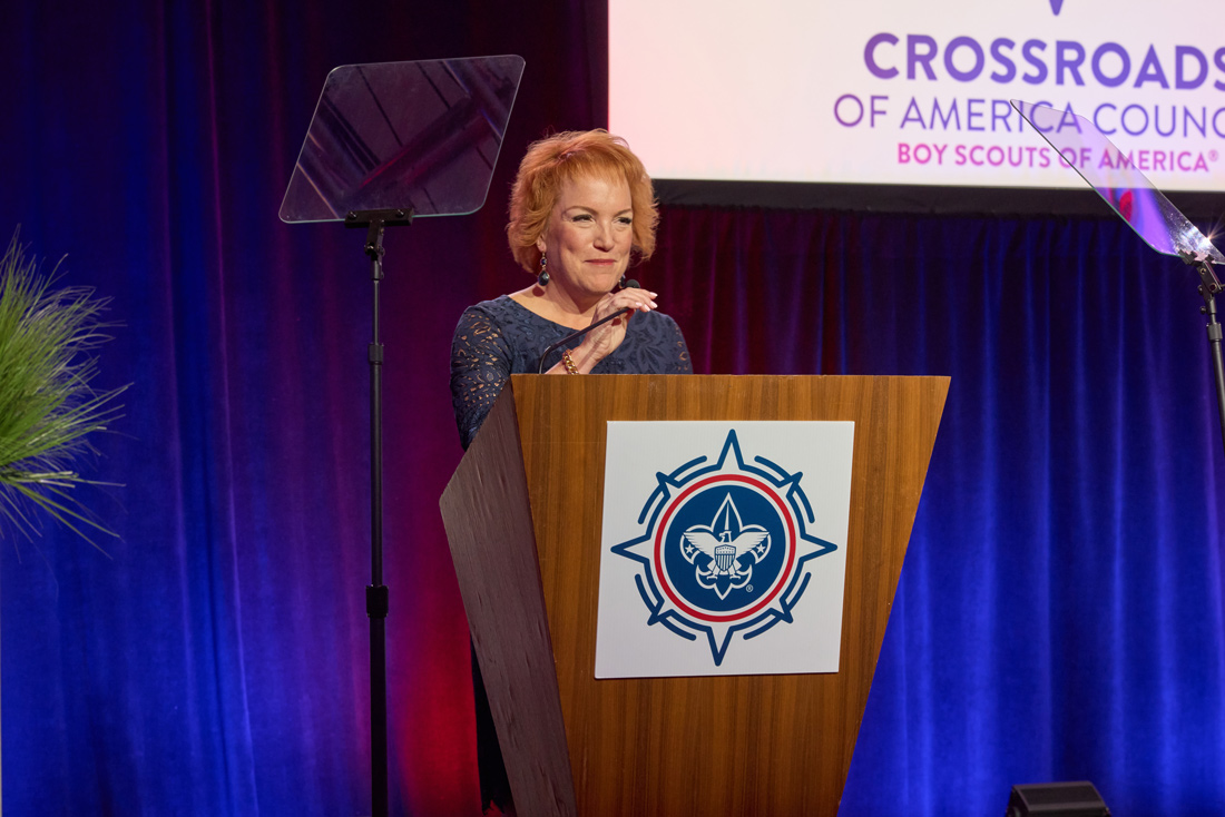 Deana Haworth speaking from a podium at the Crossroads of America Council CIA Awards
