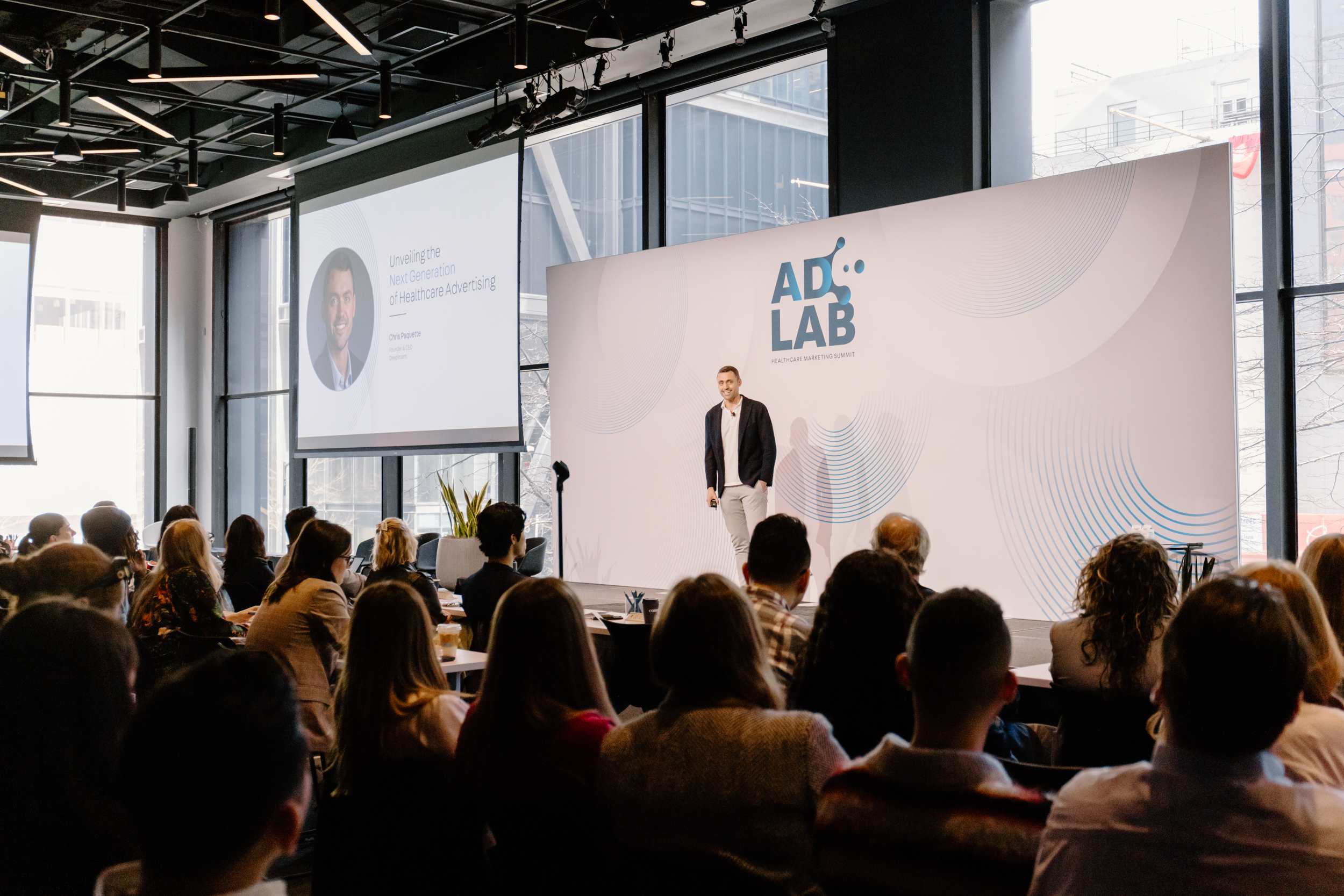 Chris Paquette presenting onstage at DeepIntent AdLab in New York