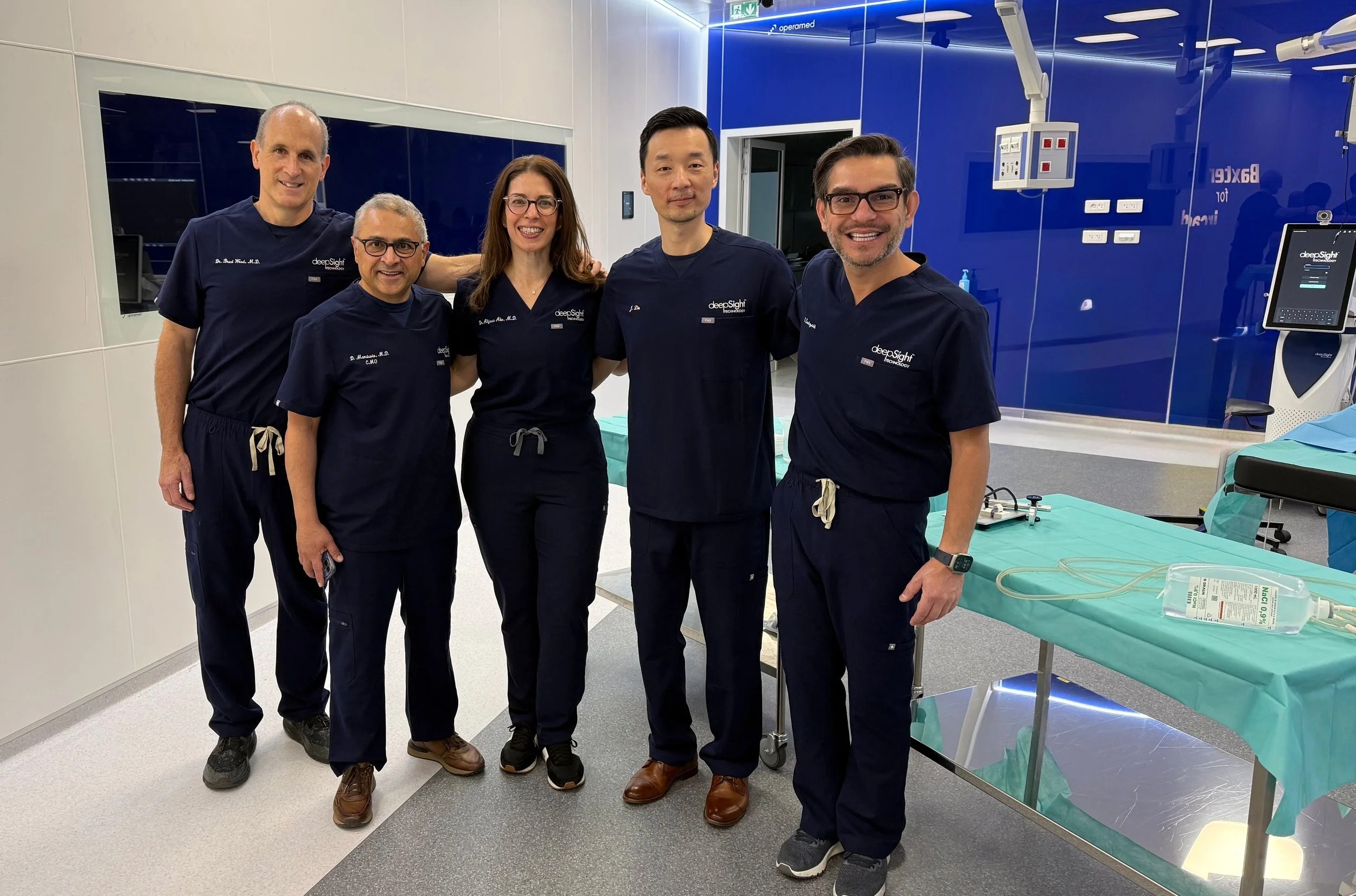 Members of the DeepSight clinical team standing in a procedure room