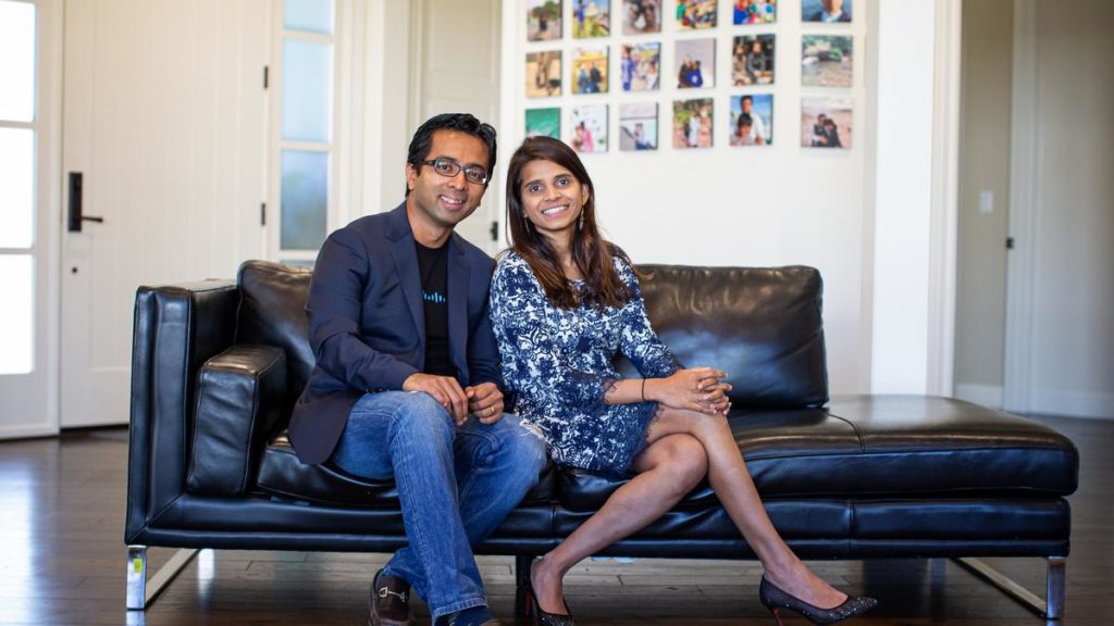 Rajat Mishra and Deepti Juturu seated together on a black sofa