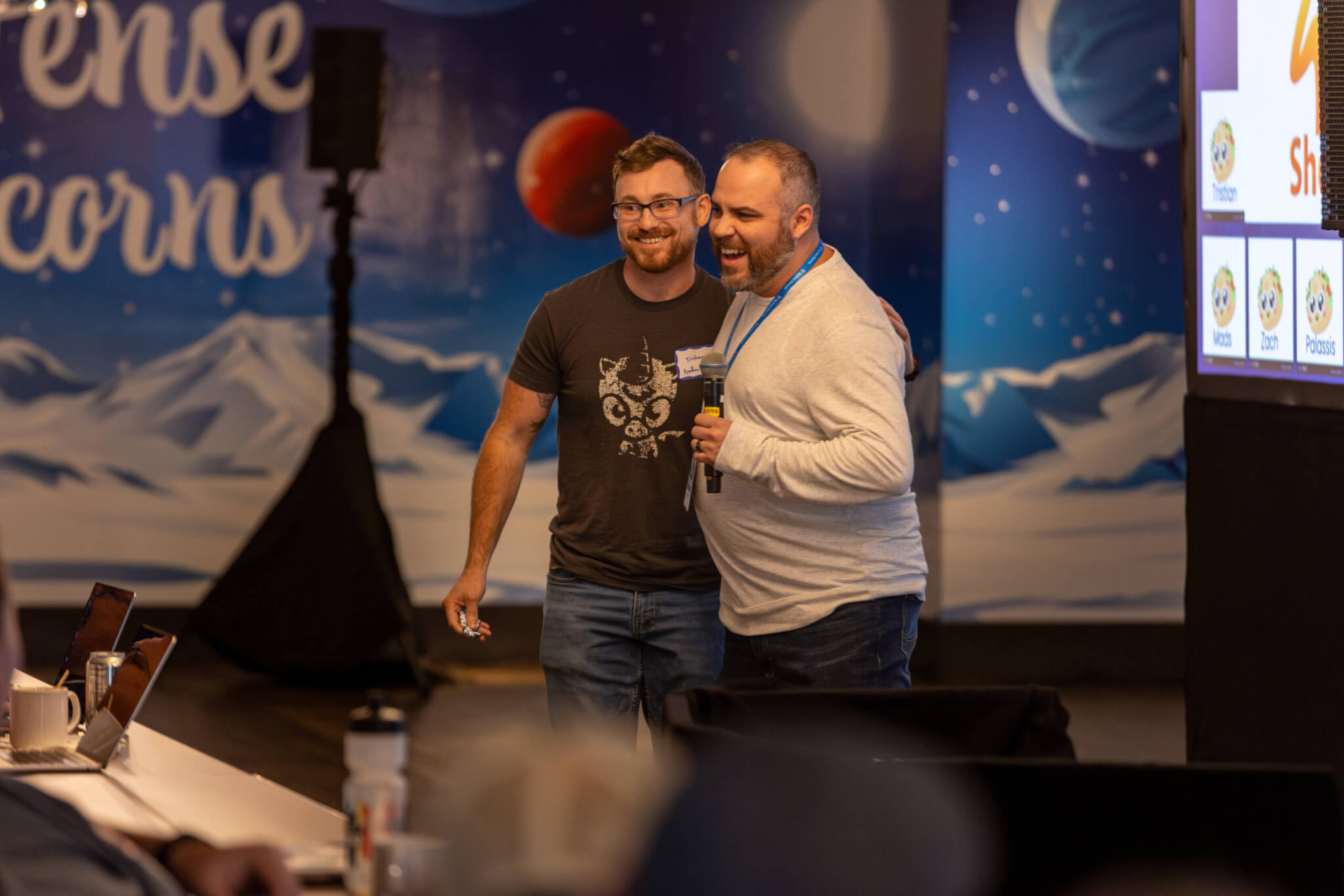Defense Unicorns colleagues sharing a laugh at a company retreat