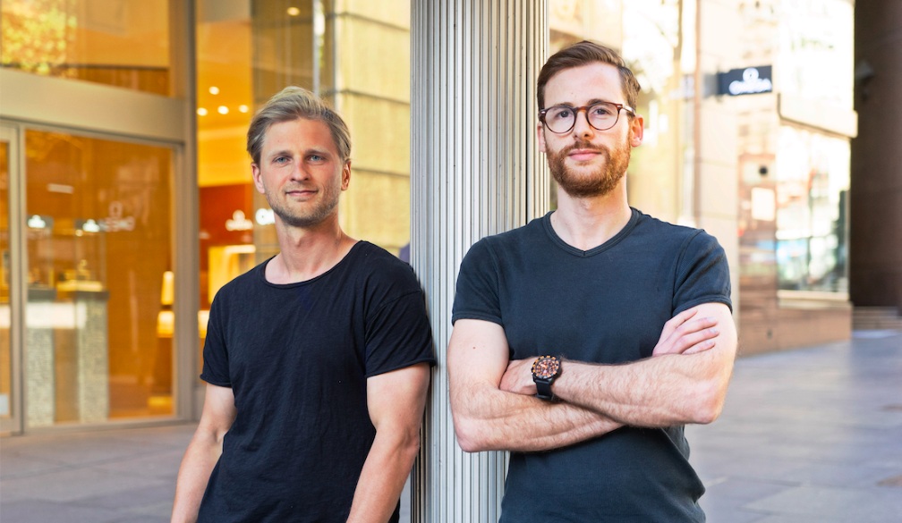 Deferit co-founders Mat Blas and Jonty Hirsowitz standing outside a building