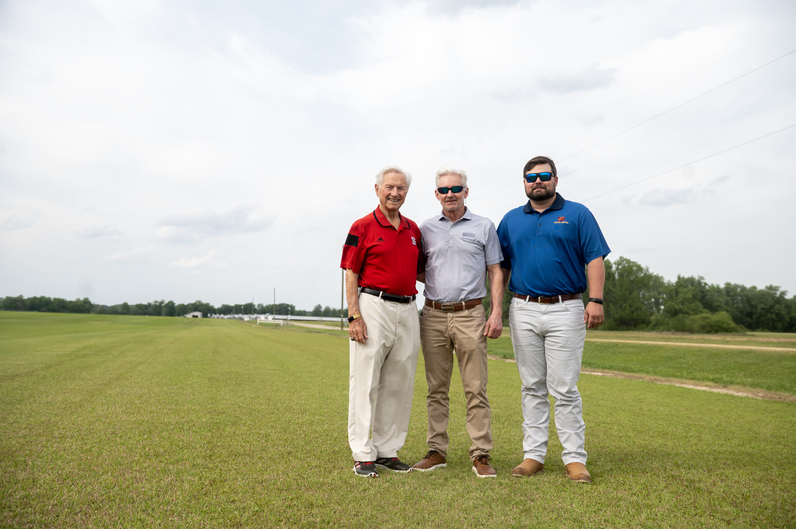 Wendell, Dell and Wen Murphy standing together at a farm in Wallace
