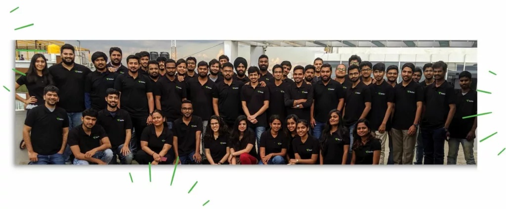 DeltaX team gathered for a group photograph in an office