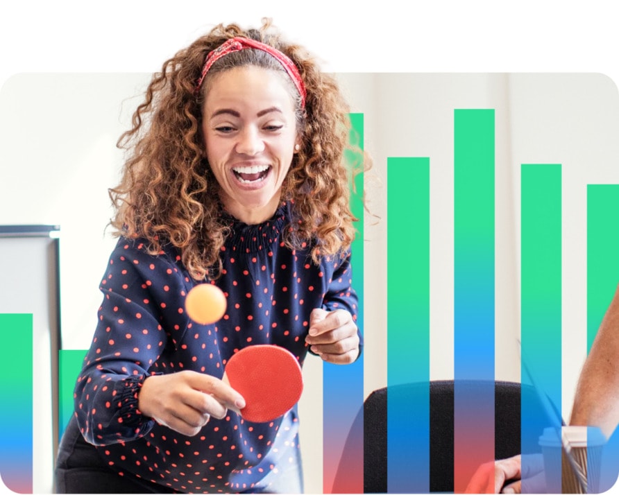 A woman playing table tennis in an office