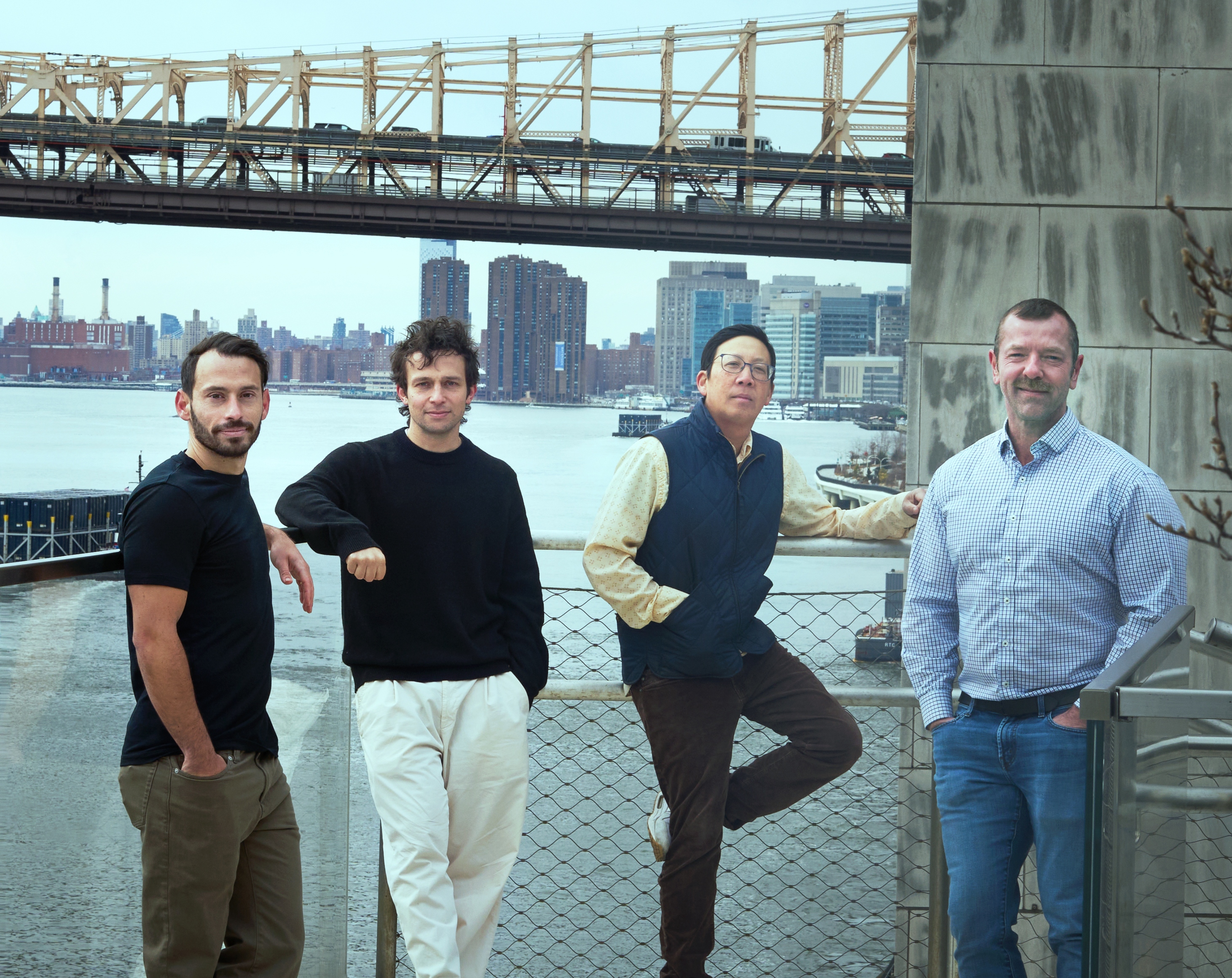 Dimi Kellari, Sam Levin, Ming Li and Sven Bocklandt standing beside the East River at Rockefeller University