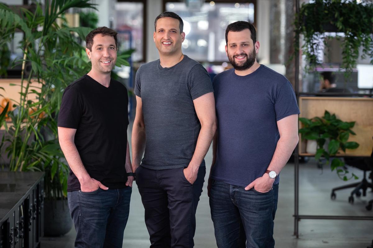 Demostack co-founders Aaron Hakim, Jonathan Friedman and Gilad Avidan together in an office