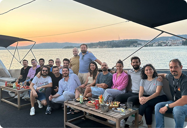 Dengage colleagues gathered on a boat during a team outing