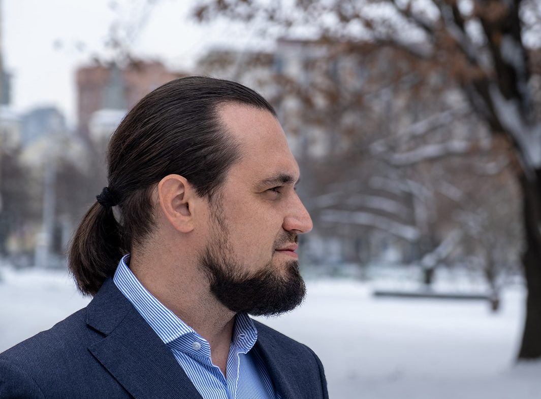 Dennis Turpitka outdoors in winter, photographed in profile