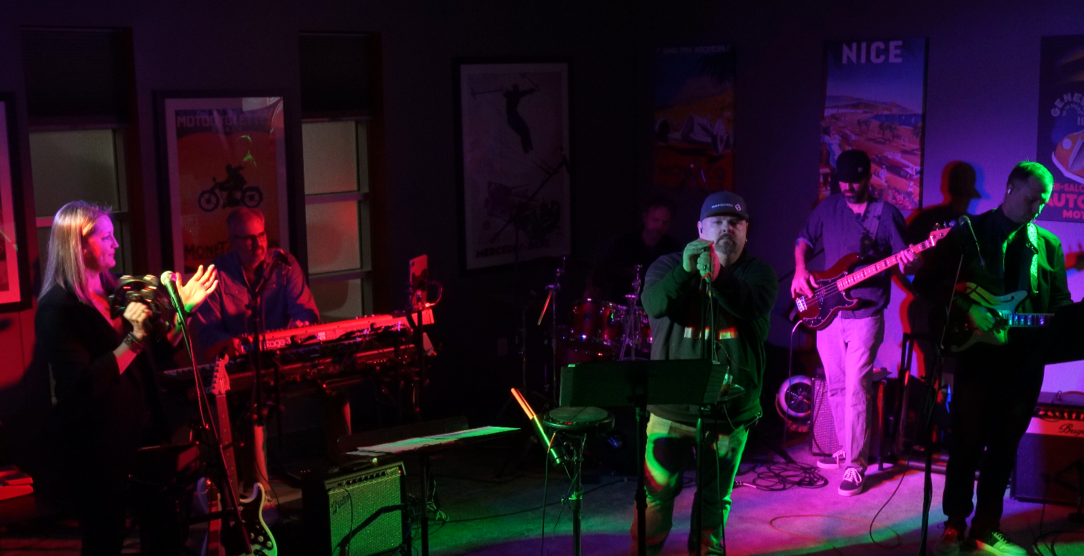 Cold Step performing on a small stage, with Derek Bang at the keyboards on the left