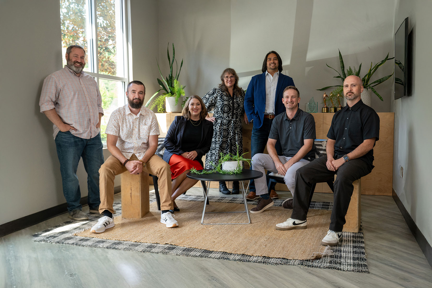 The PopFizz Productions team gathered in a bright office