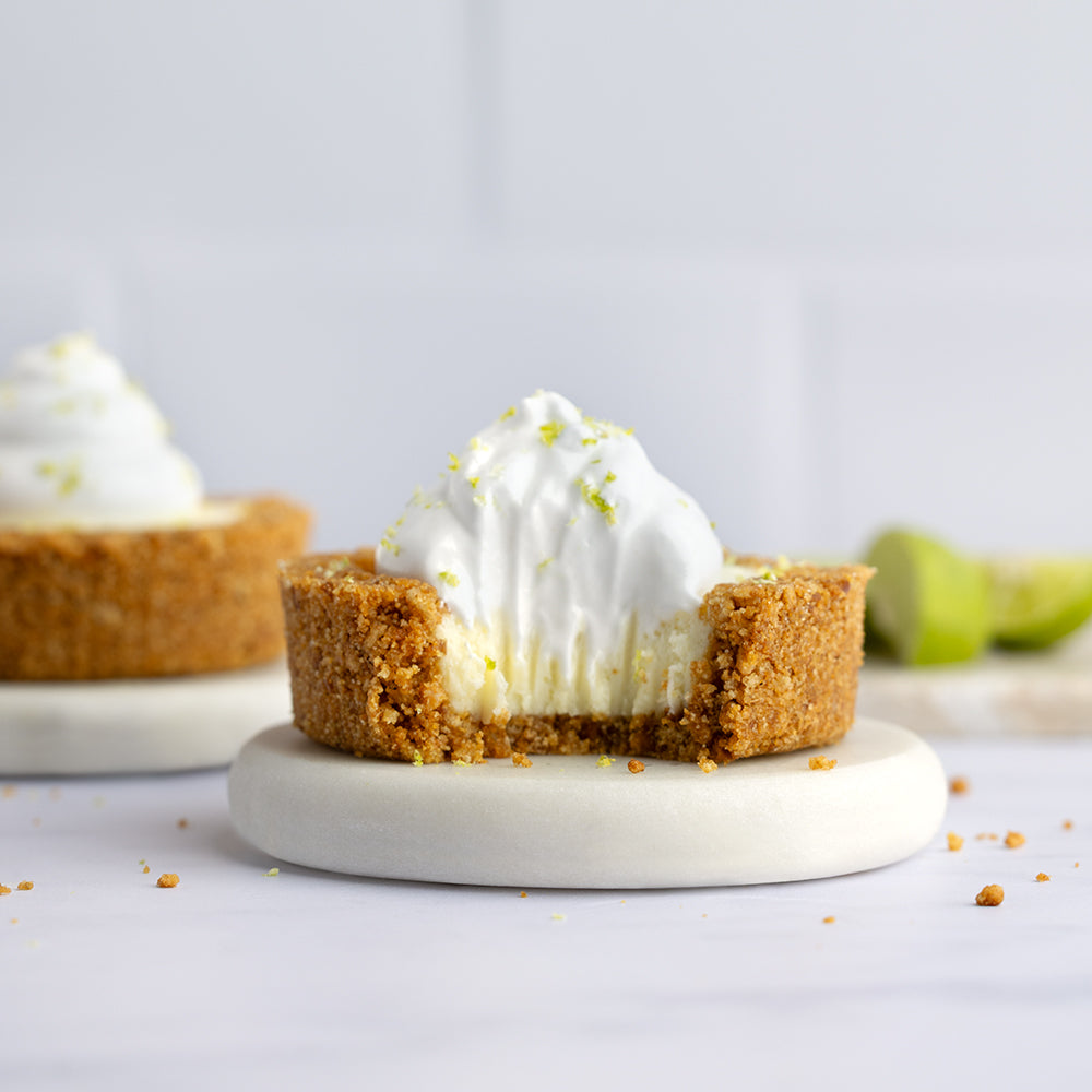 Individual Key lime cream pies topped with whipped cream