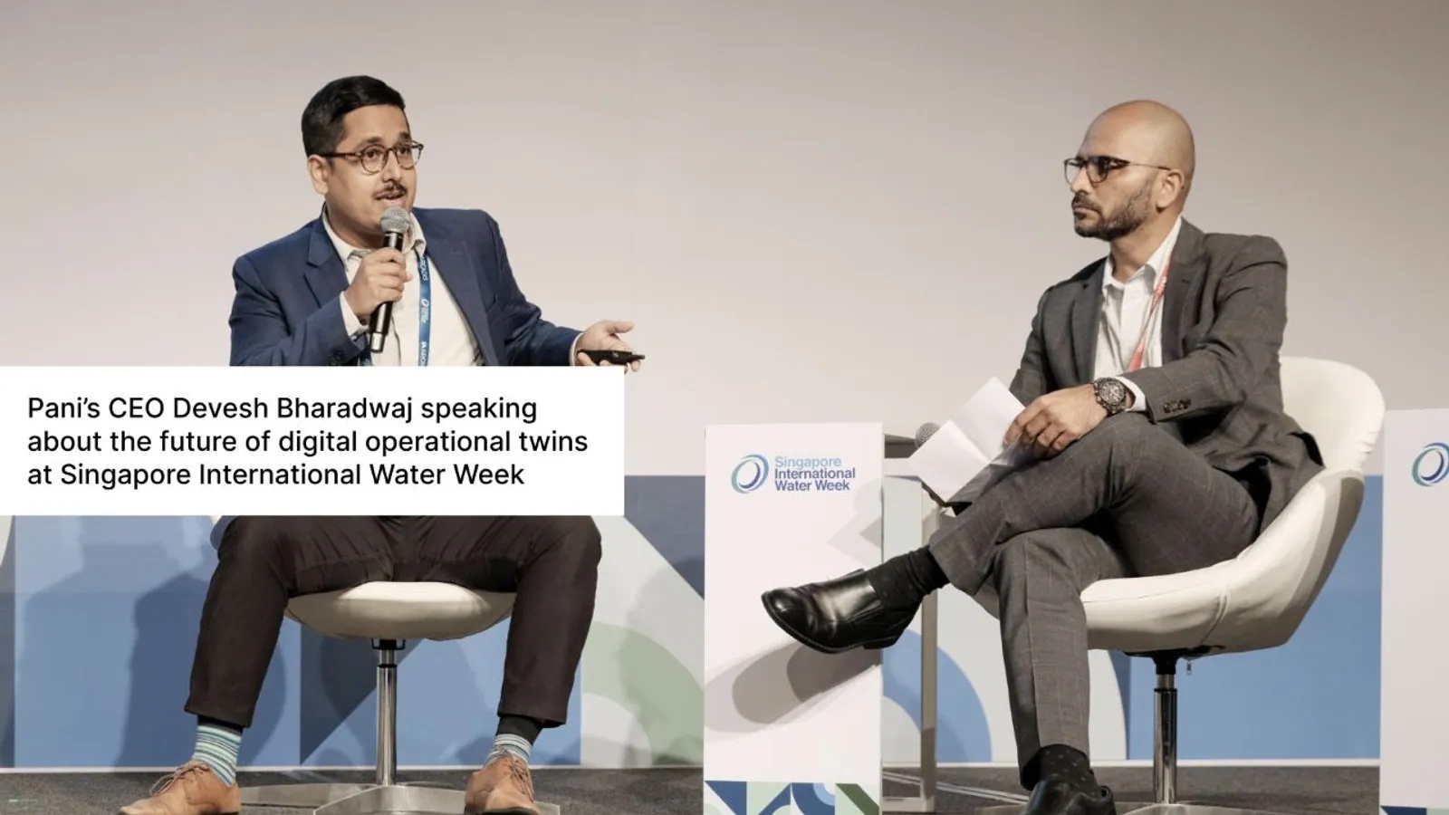 Devesh Bharadwaj, seated at left with a microphone, speaking at Singapore International Water Week in 2022