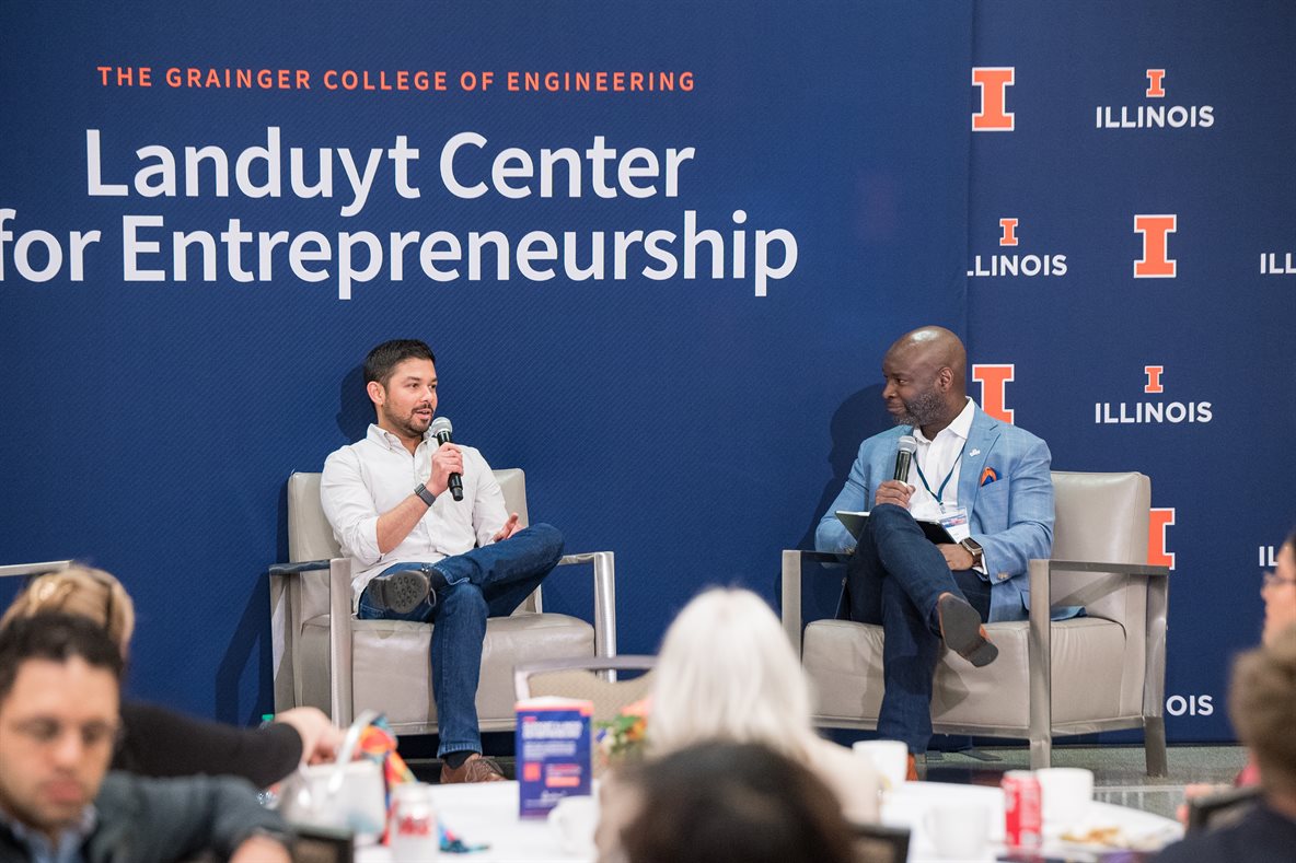 Devin Bhushan, left, speaking with Gerald Wilson at the University of Illinois