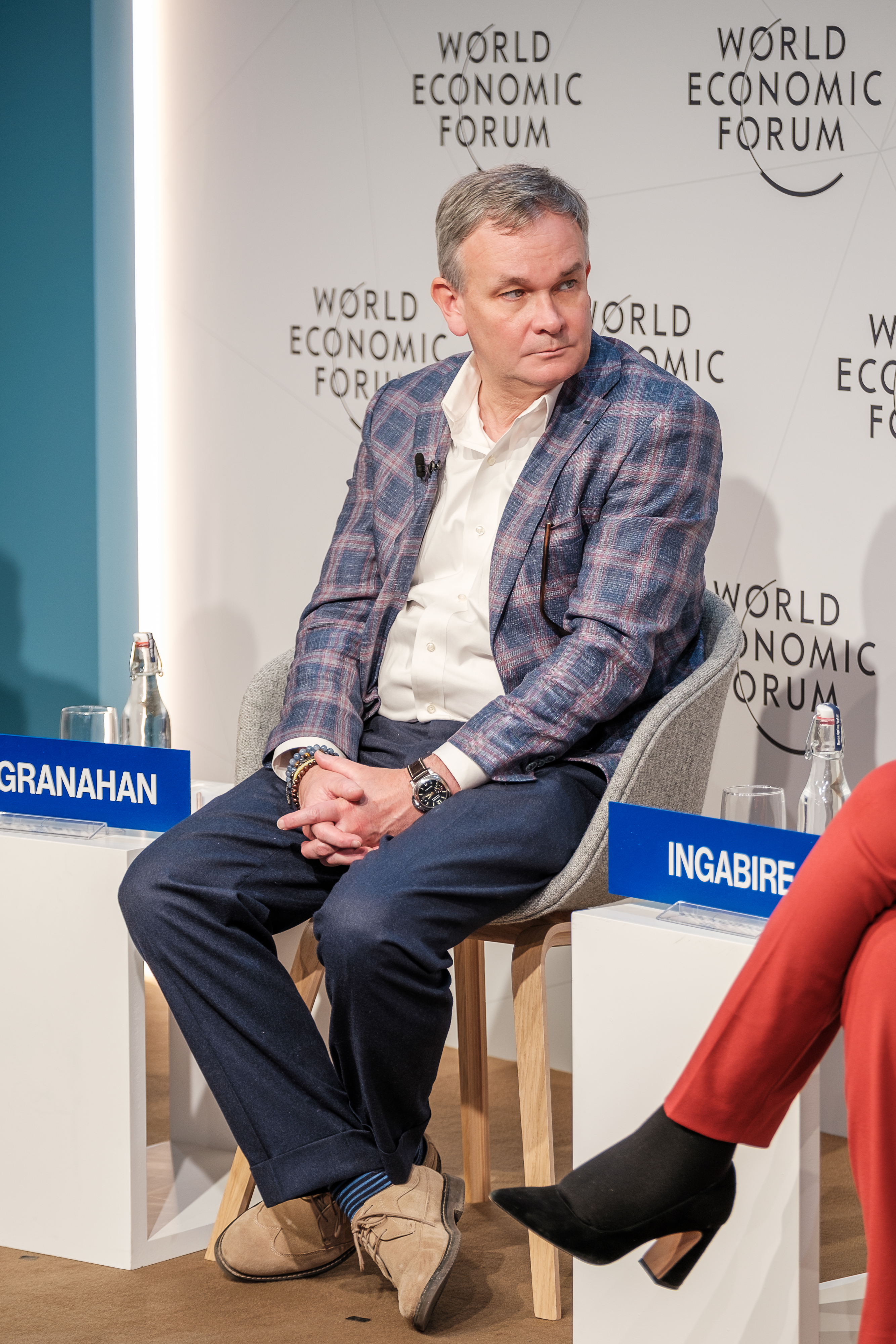 Devin McGranahan seated on a panel at the World Economic Forum in Davos in January 2023