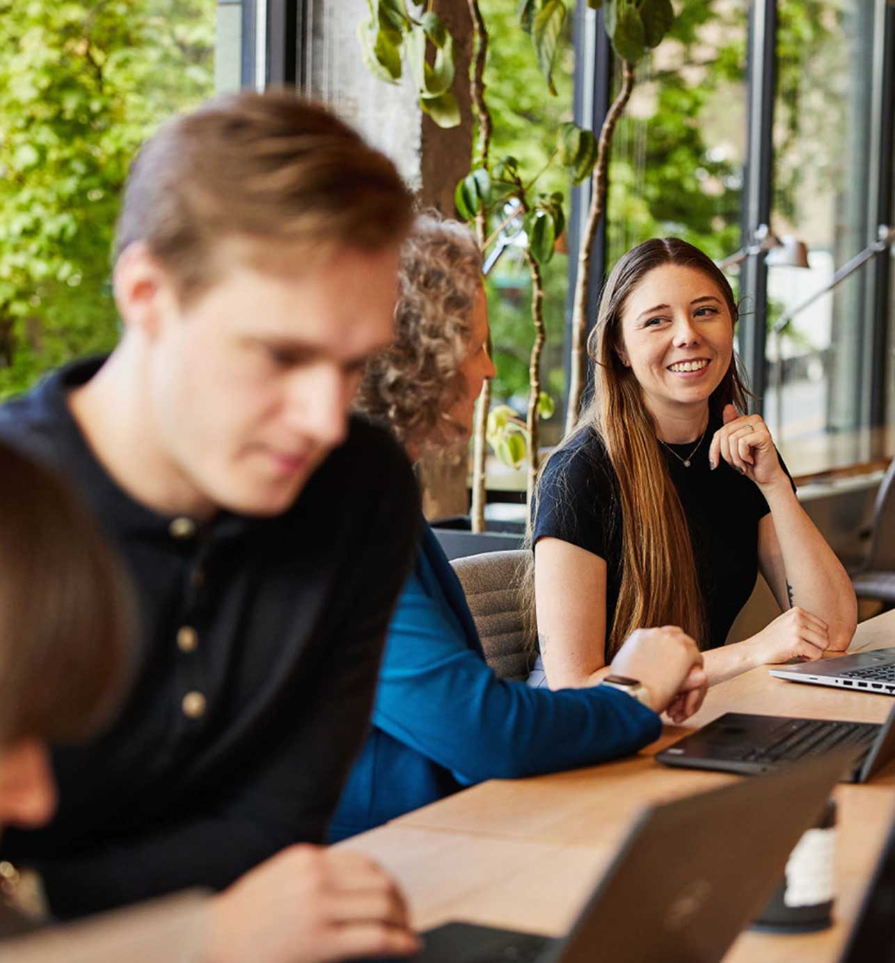 DH colleagues working together around a table in a bright office