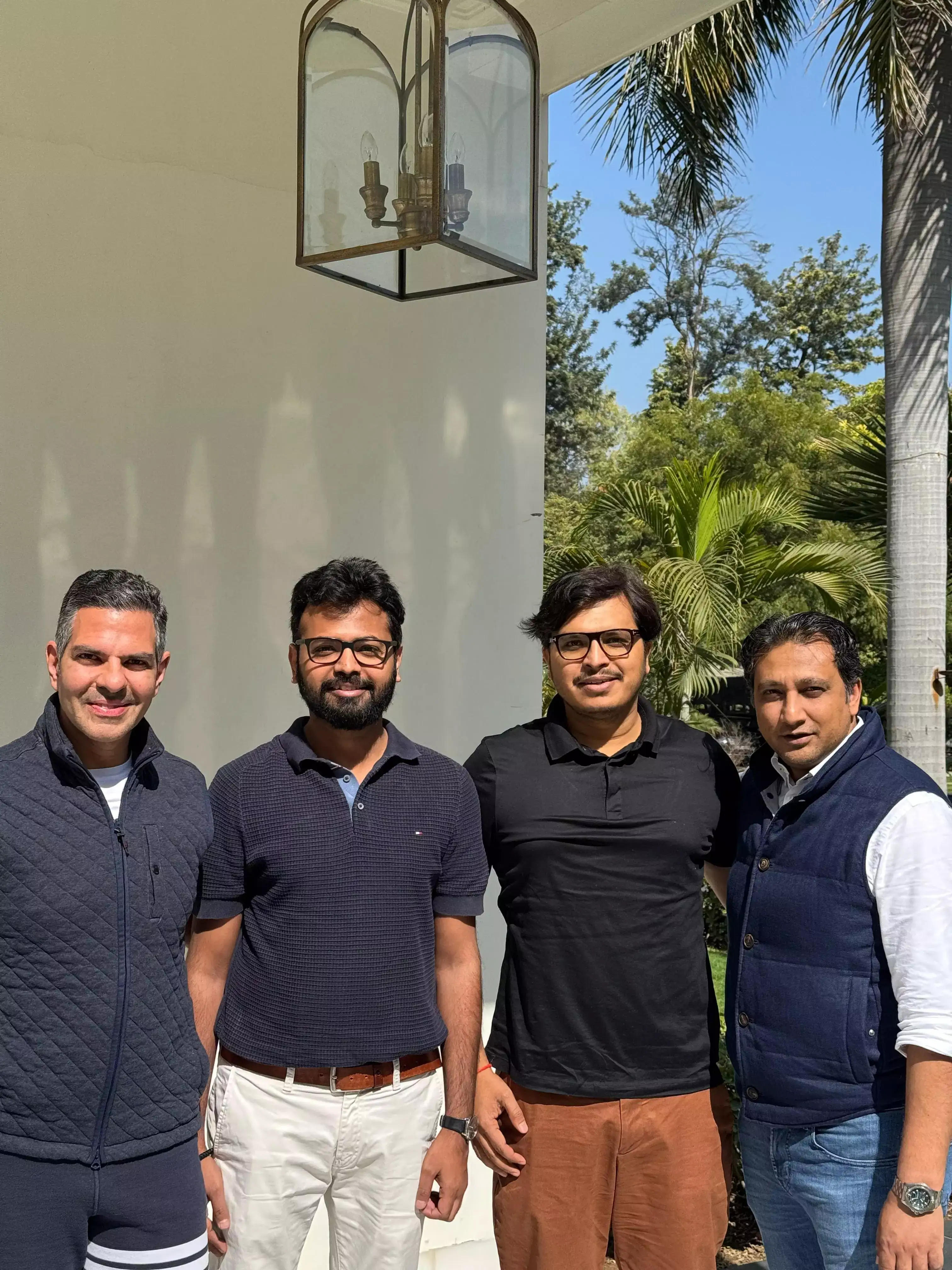 Sunjay Kapur, Himanshu Singh Raghuvanshi, Dheeraj Tiwari and Vivek Vikram Singh standing together outdoors