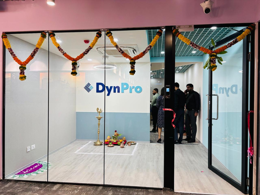 Flowers and a ceremonial lamp at the entrance to DynPro’s new Pune office