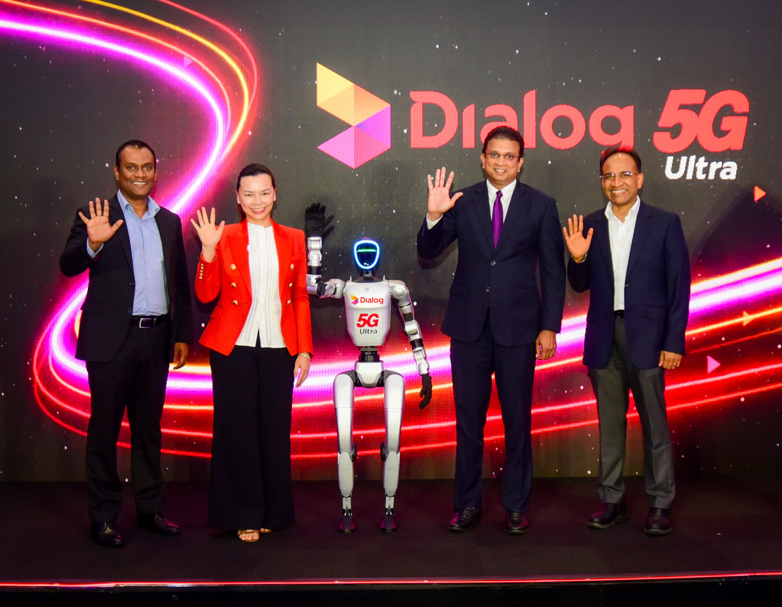Dialog executives and NOVA the humanoid robot at the December 2025 5G Ultra launch