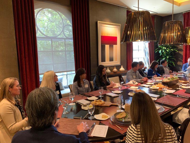 Participants seated around a table at Teneo’s Chief Communications Officers lunch in Los Angeles