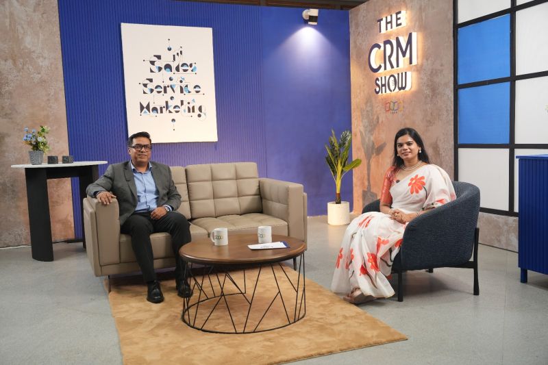 Dibyendu Panda seated opposite Harshini Ravikumar on the set of The CRM Show