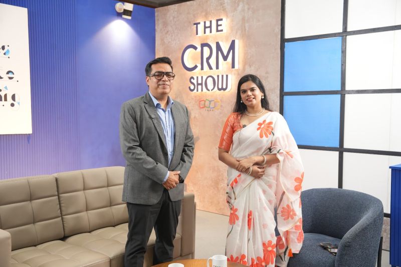 Dibyendu Panda and Harshini Ravikumar standing together on The CRM Show set