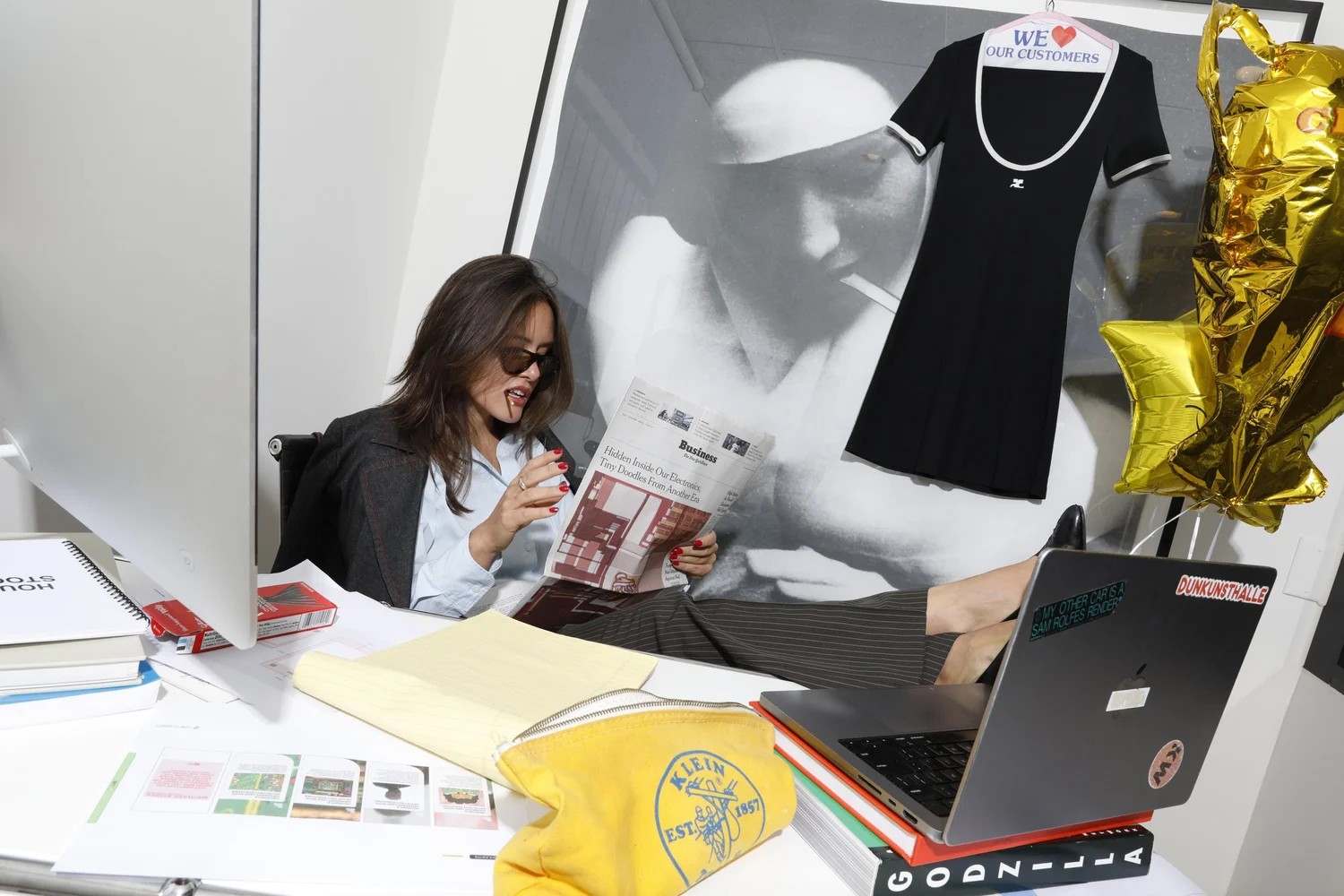 Digital Counsel founder Marcella Zimmermann reading at a desk surrounded by campaign materials