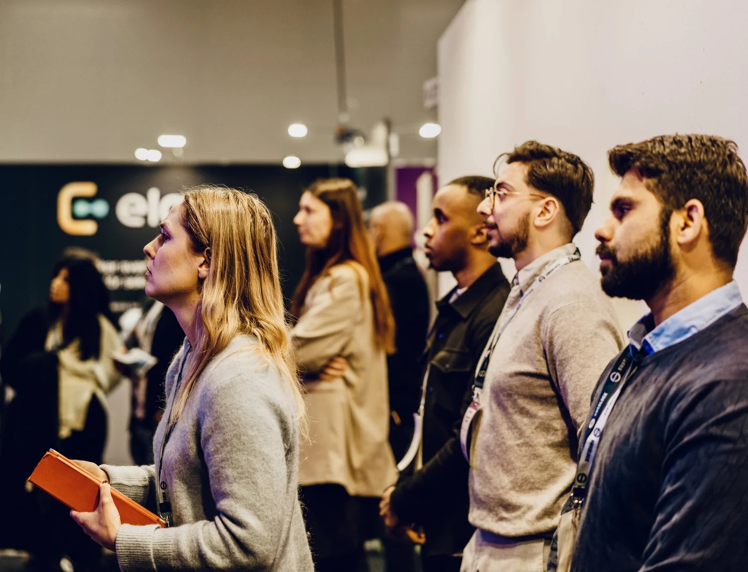 Startup founders and guests watching a presentation at a DigitalWell Ventures event