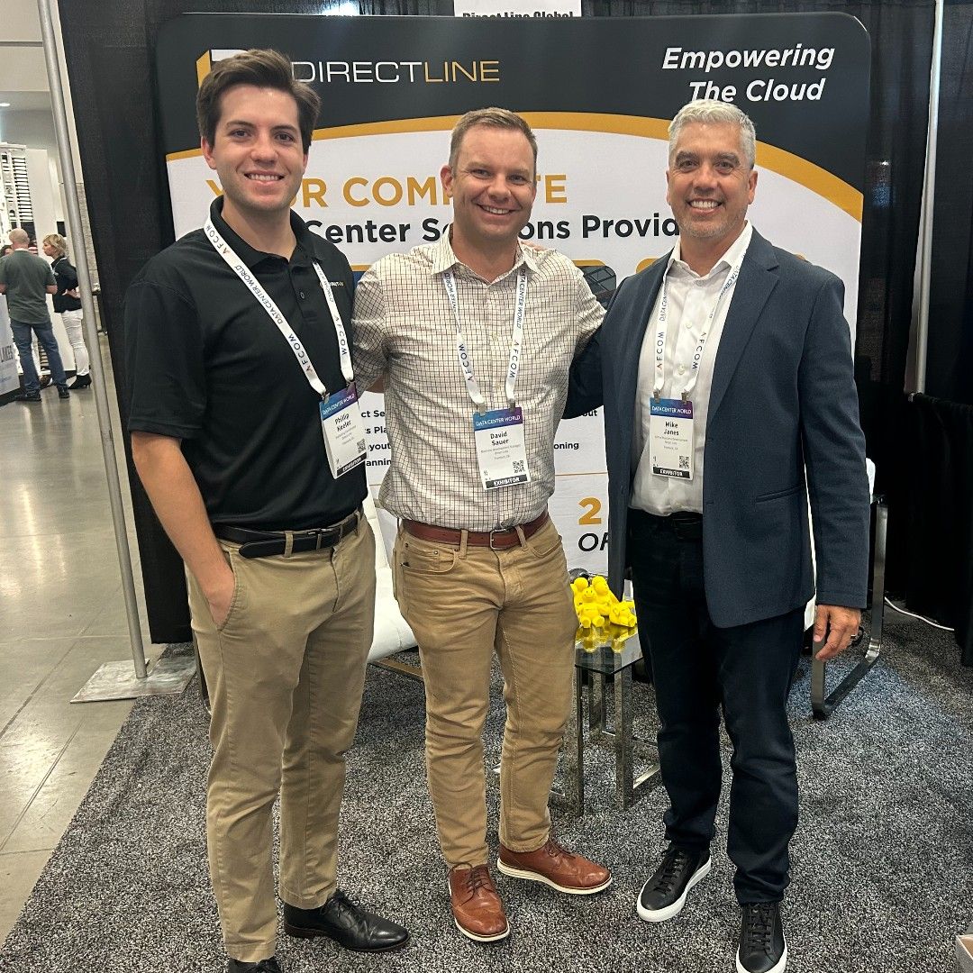 Three Direct Line Global representatives at the company’s Data Center World 2024 exhibition booth