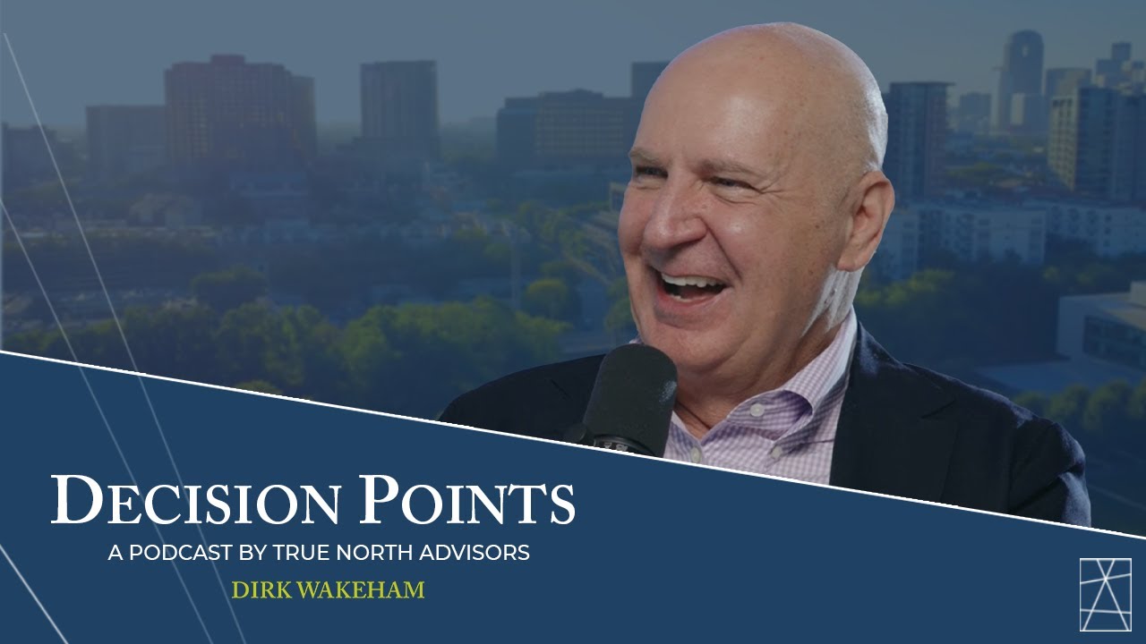 Dirk Wakeham speaking into a microphone in the Decision Points interview promotional image