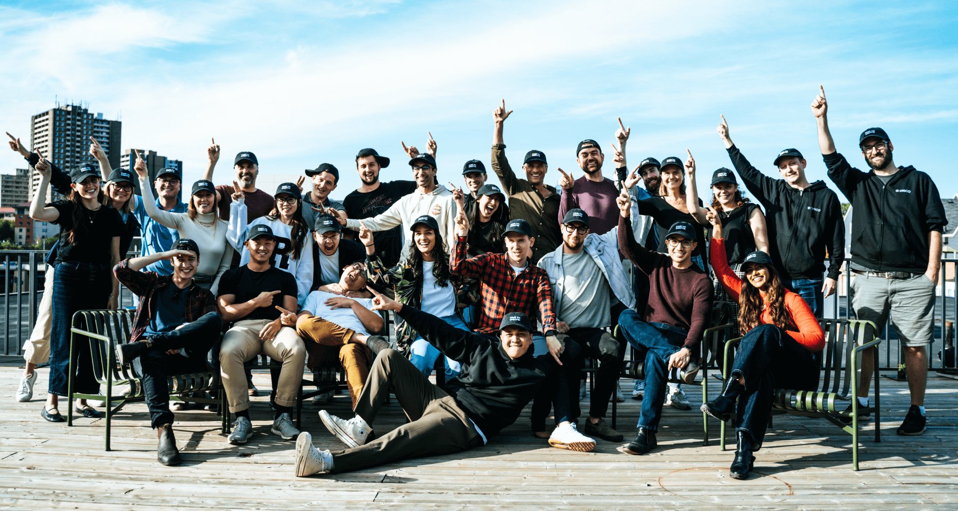 Disco team members gathered outdoors for a company photograph