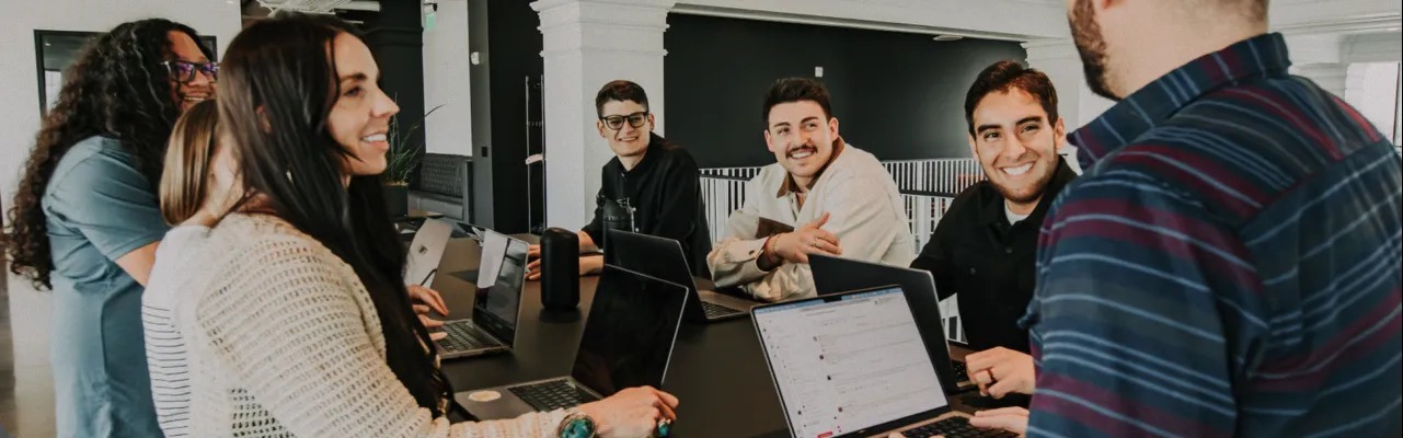 BILL employees working around a conference table in an office