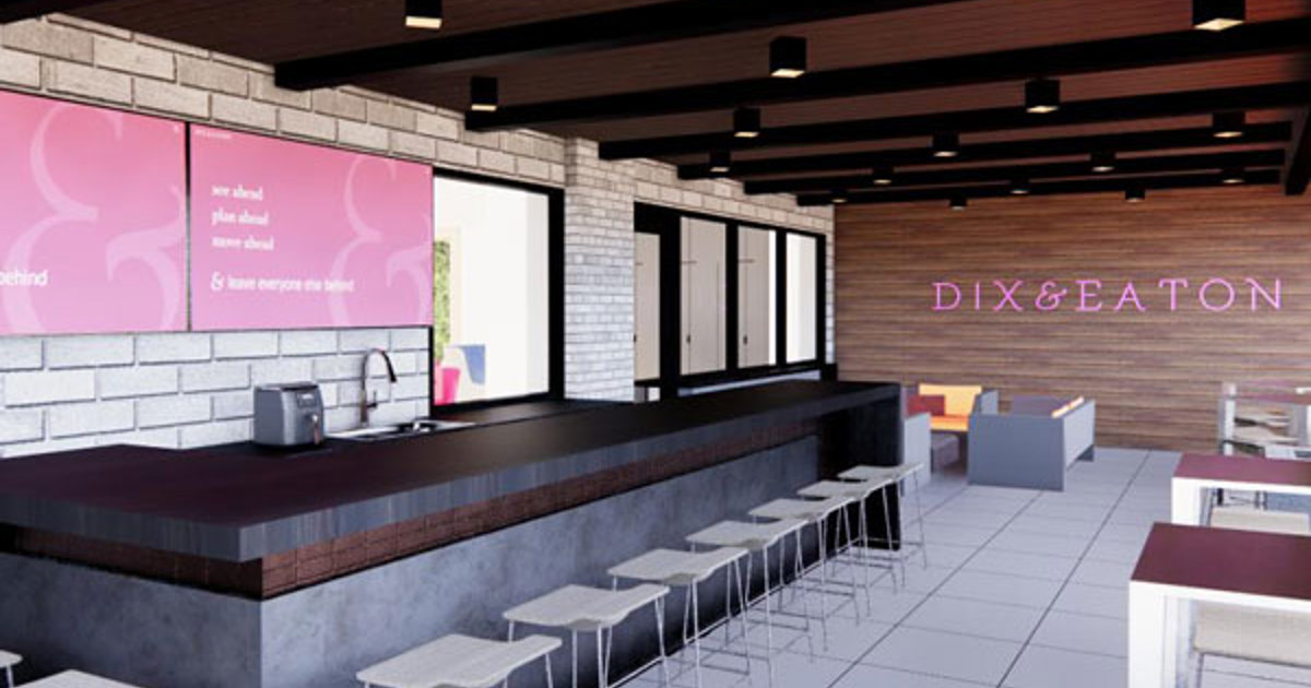 Rendering of a modern Dix and Eaton office lounge with a long counter and illuminated wall sign
