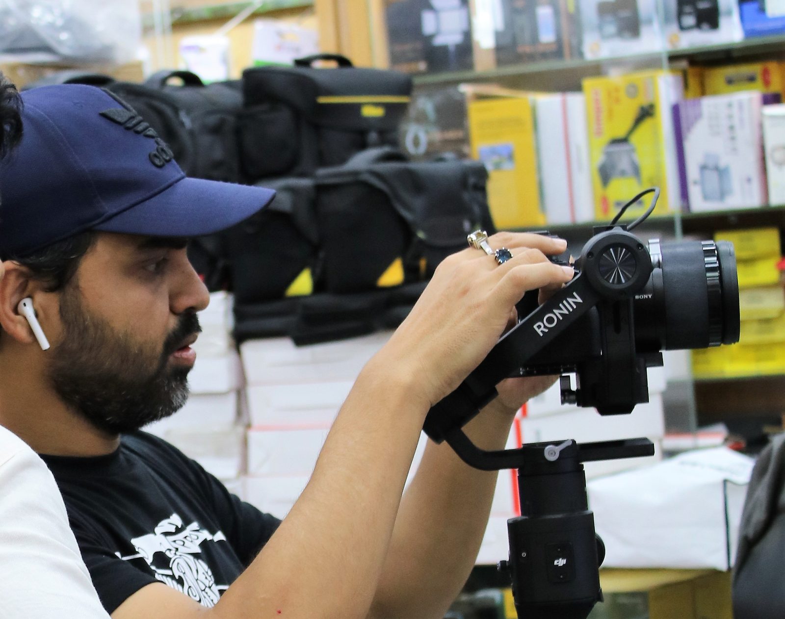 A person operating a DJI Ronin-S handheld camera gimbal
