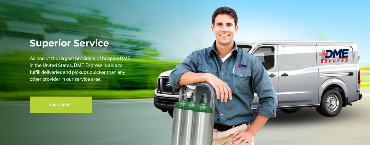 A DME Express technician with oxygen cylinders beside a delivery van