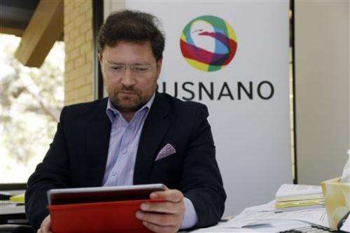 Dmitry Akhanov working with a tablet at his Menlo Park office