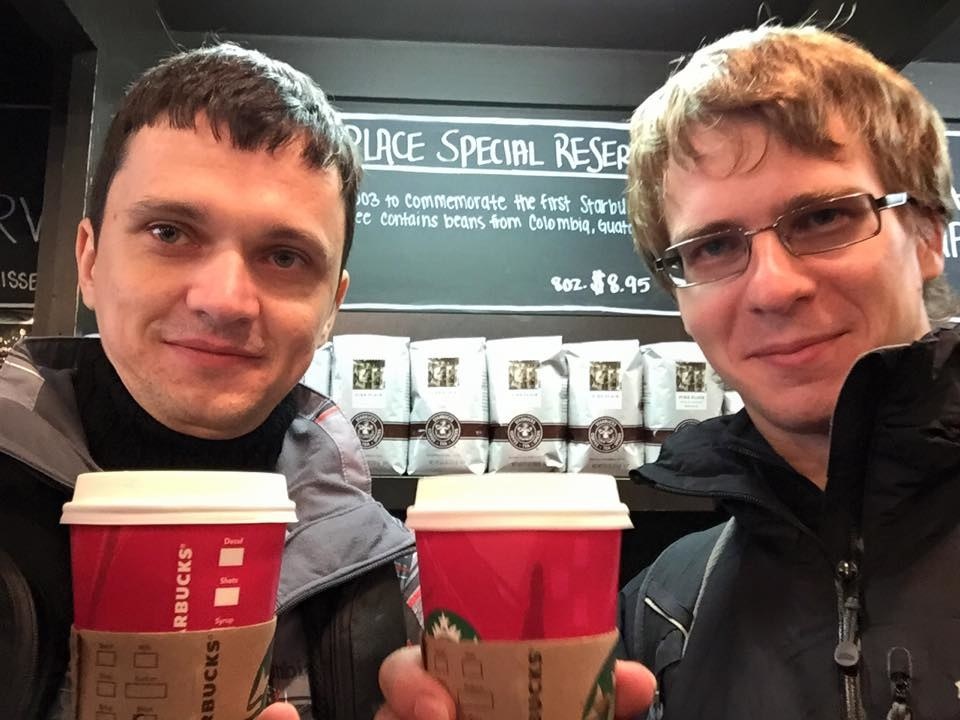 Dmytro Gerasymenko, left, in a candid photograph with takeaway coffee