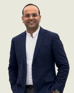 DNA Growth founder and CEO Akshay Jain in a navy jacket