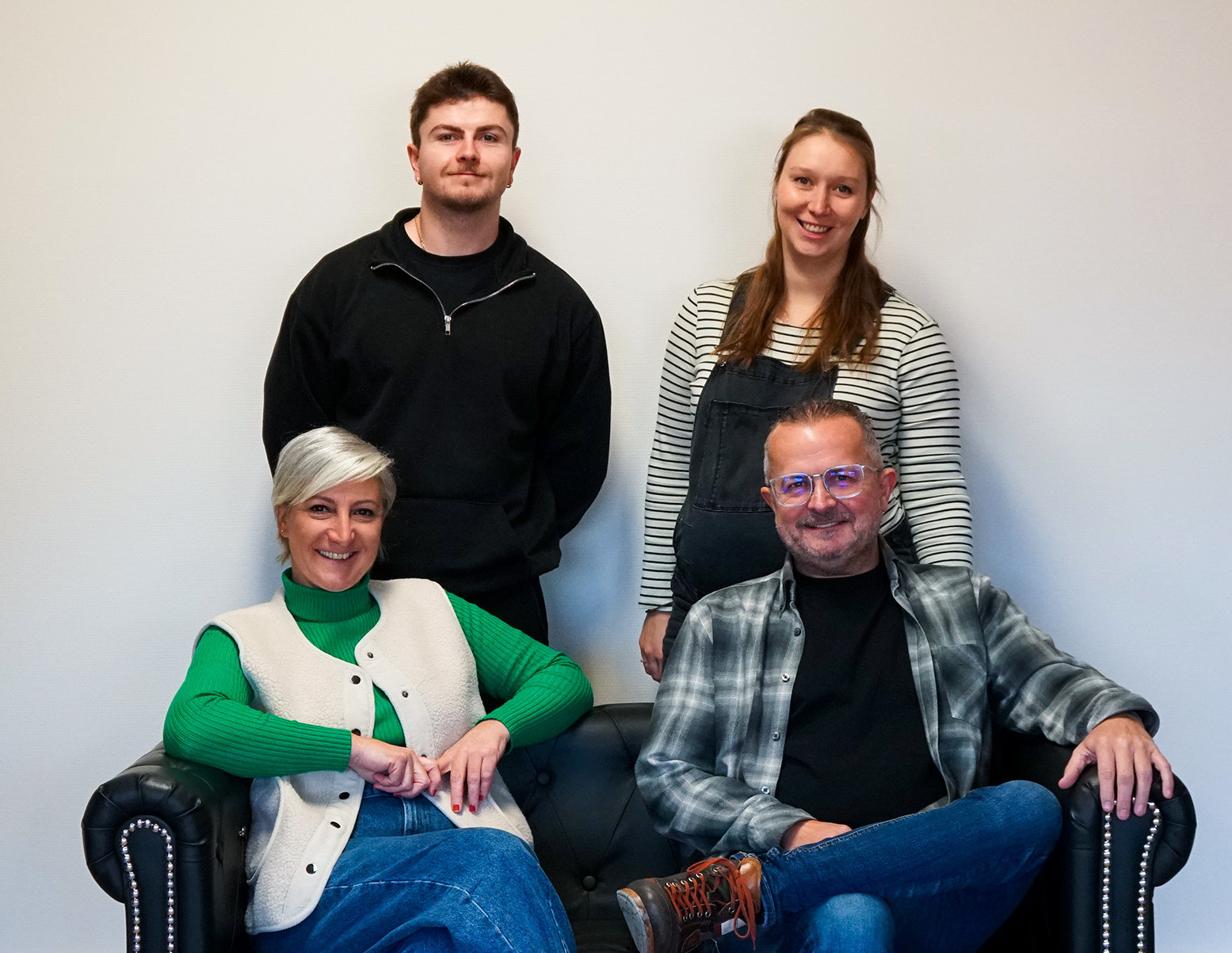 Members of the DNA Marketing team working together in the office
