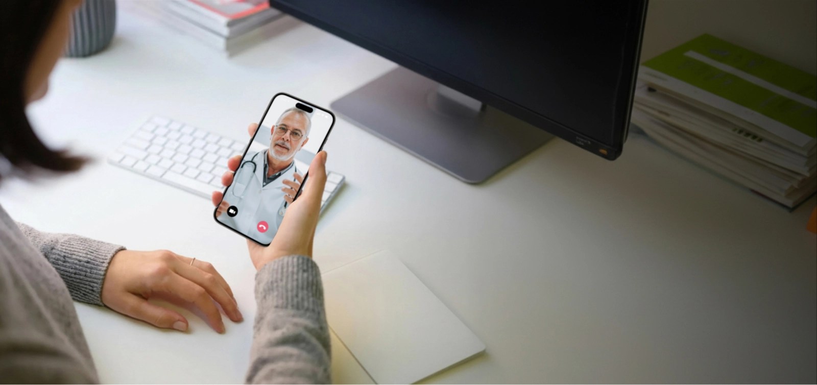 Woman uses a smartphone during a telemedicine conversation