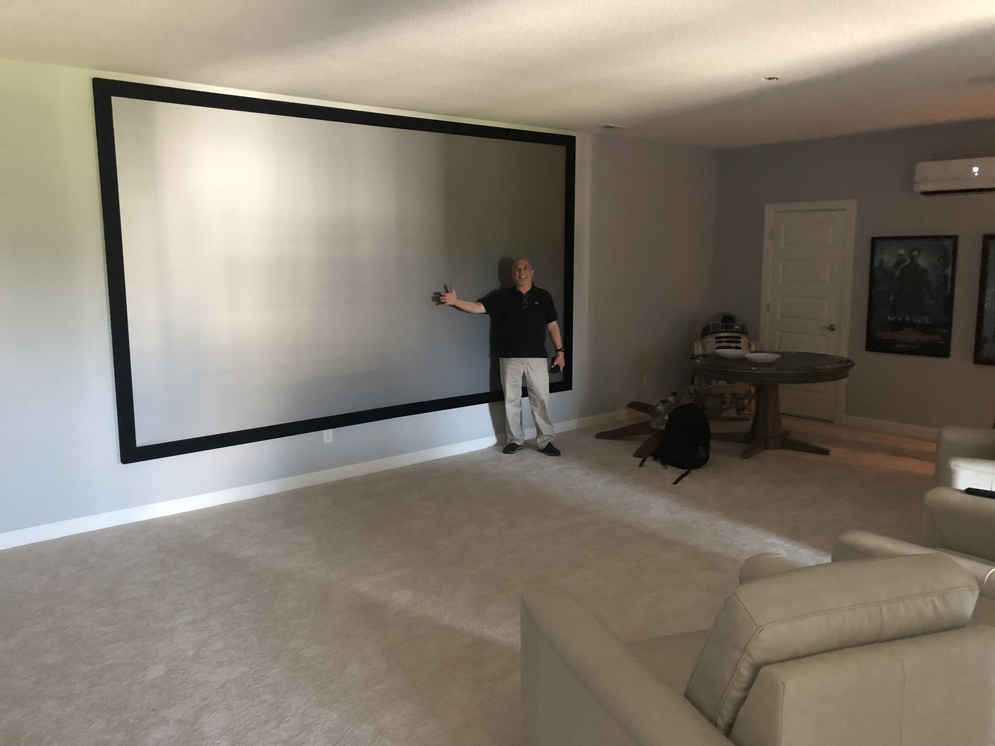 Large-format home theater with an oversized projection screen