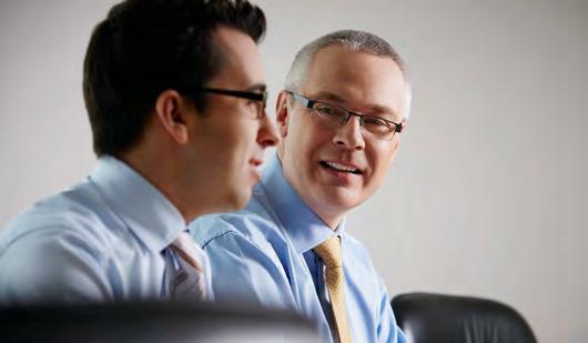 Dominic Hains, left, in conversation with Gary Walters in RGA’s 2012 annual review