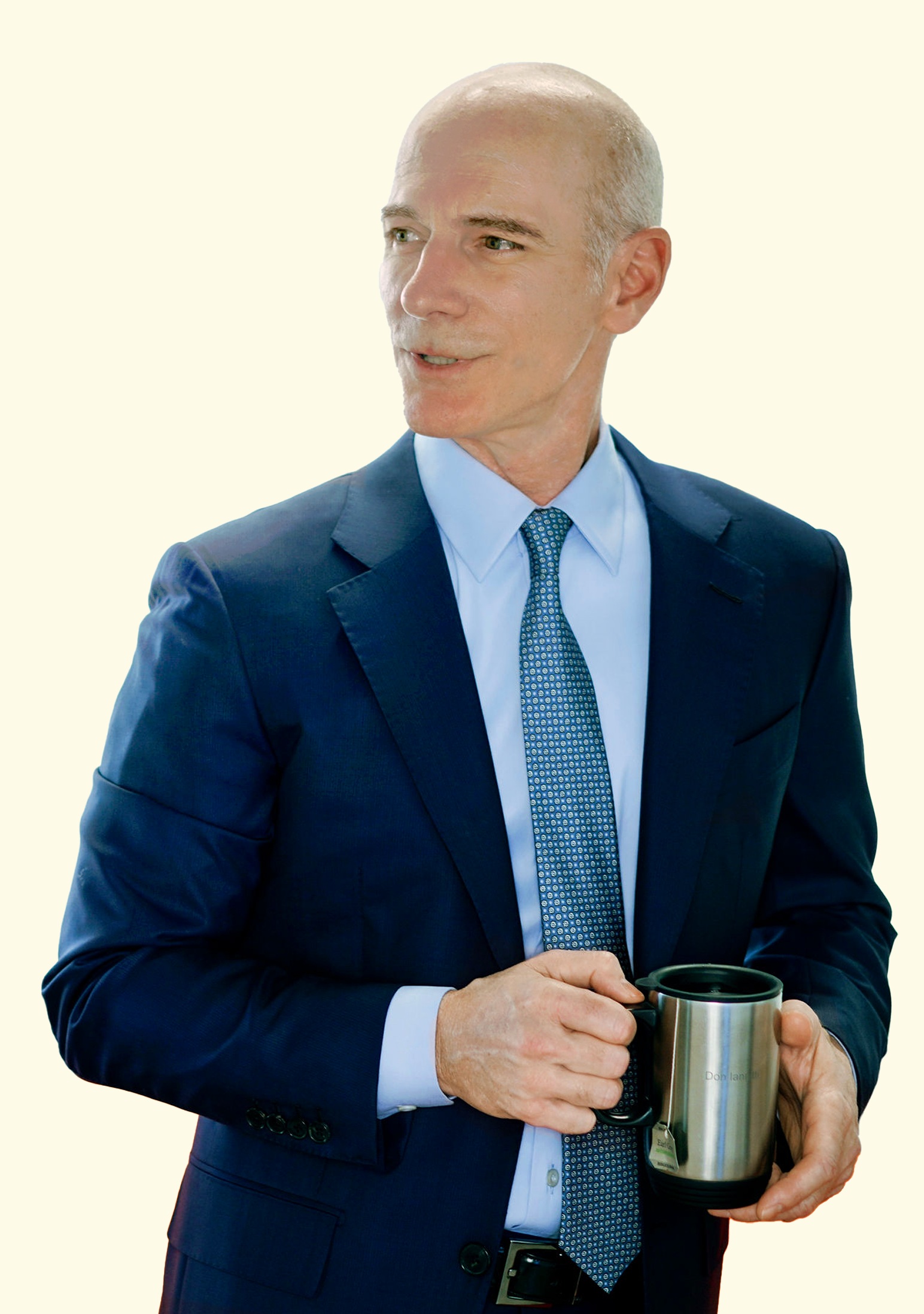 Dominic Iannitti holding a metal mug and looking to his right