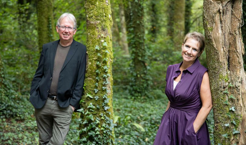 Donal Daly and Ingrid De Doncker standing among trees