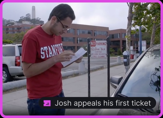 Joshua Browder in a Stanford T-shirt beside parking meters, reviewing paperwork