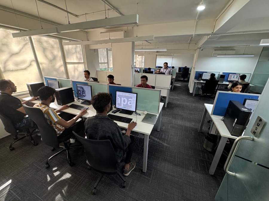 Artists at computers in Binated’s production center