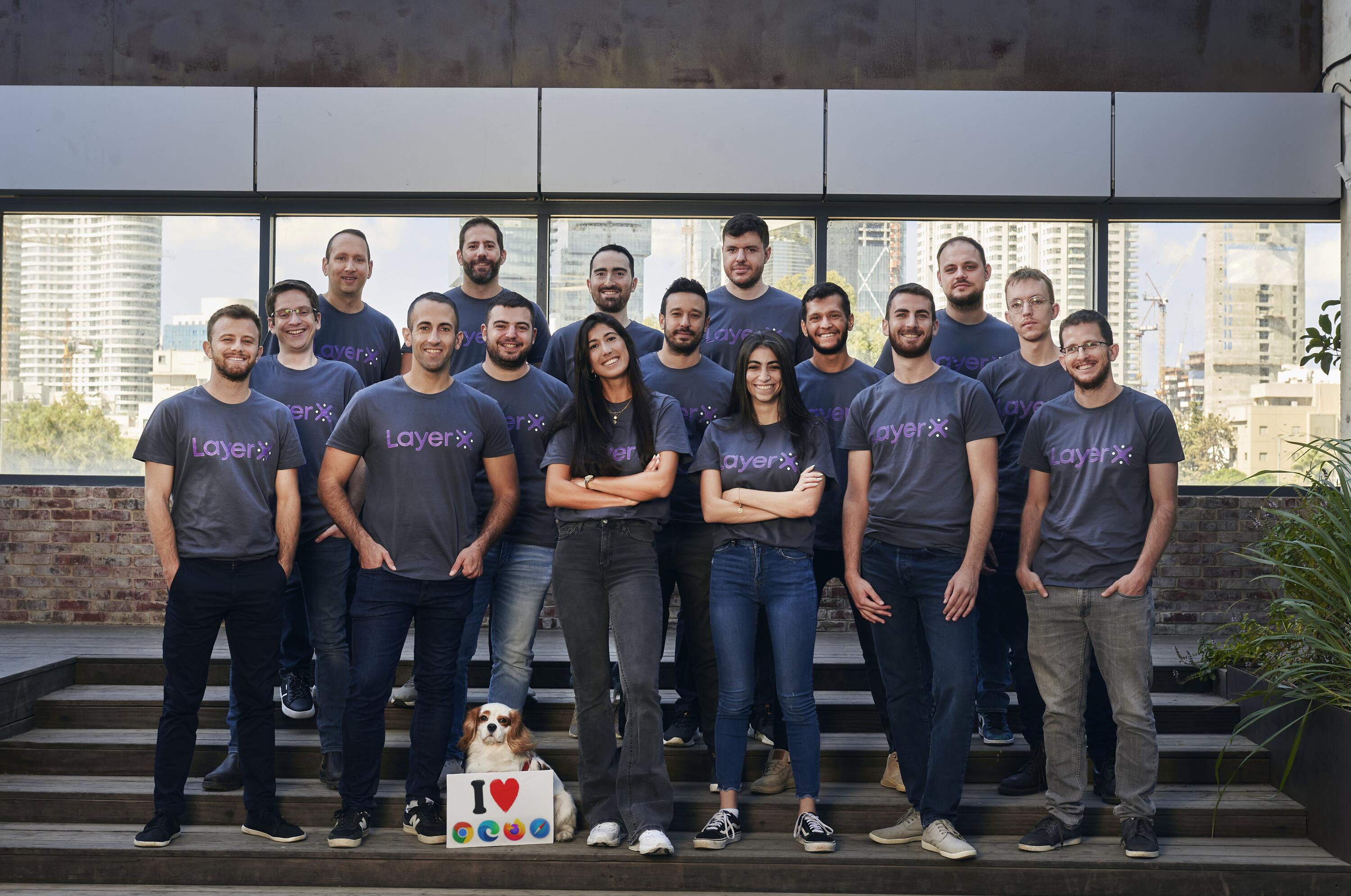 The LayerX Security team wearing company shirts on a Tel Aviv terrace in 2022