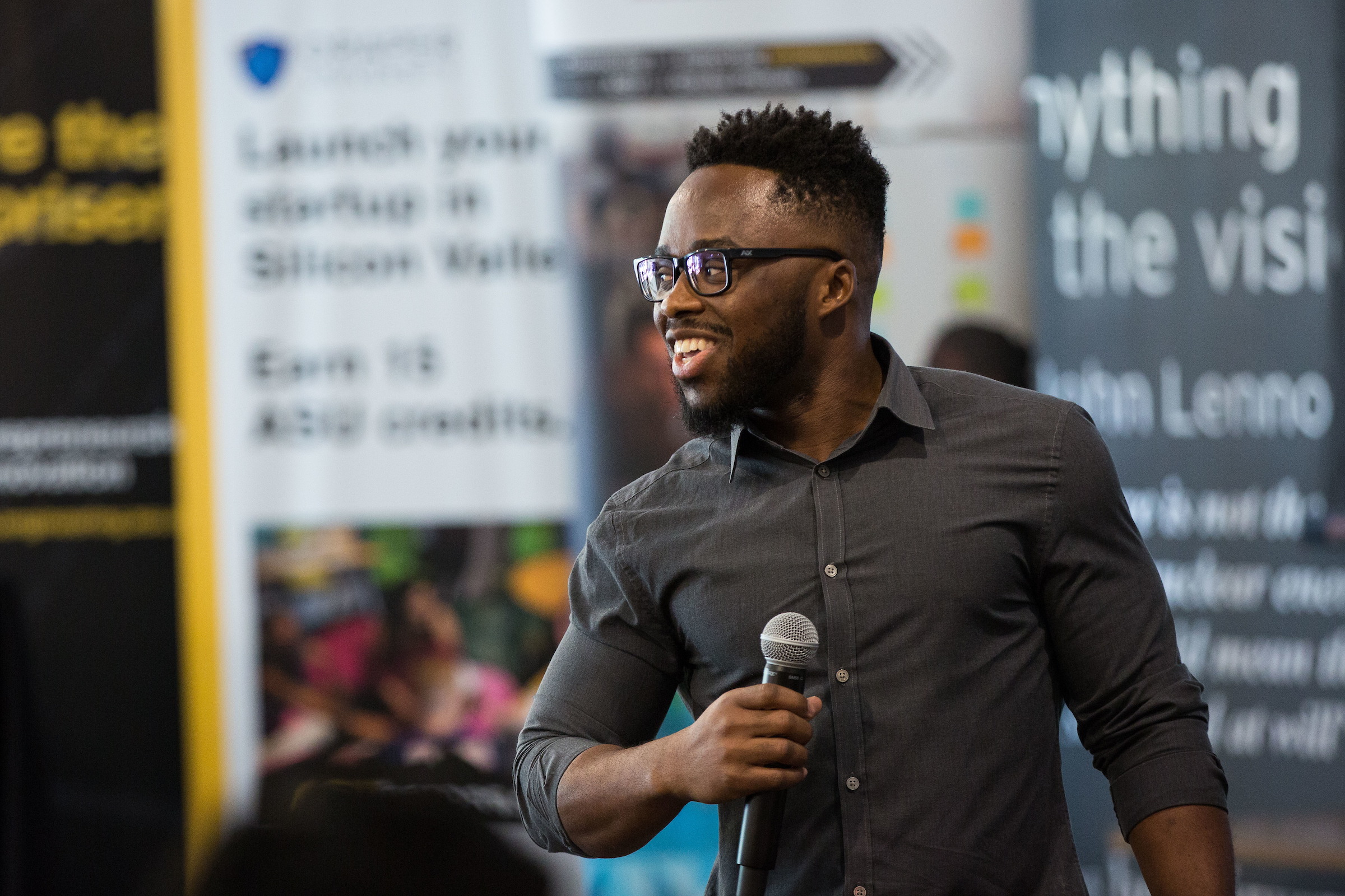 Dornubari Vizor speaking with a microphone at an Arizona State University entrepreneurship event