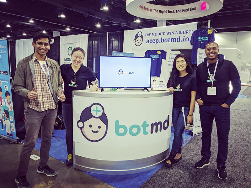 Dorothea Koh, second from left, with three Bot MD team members at an exhibition booth